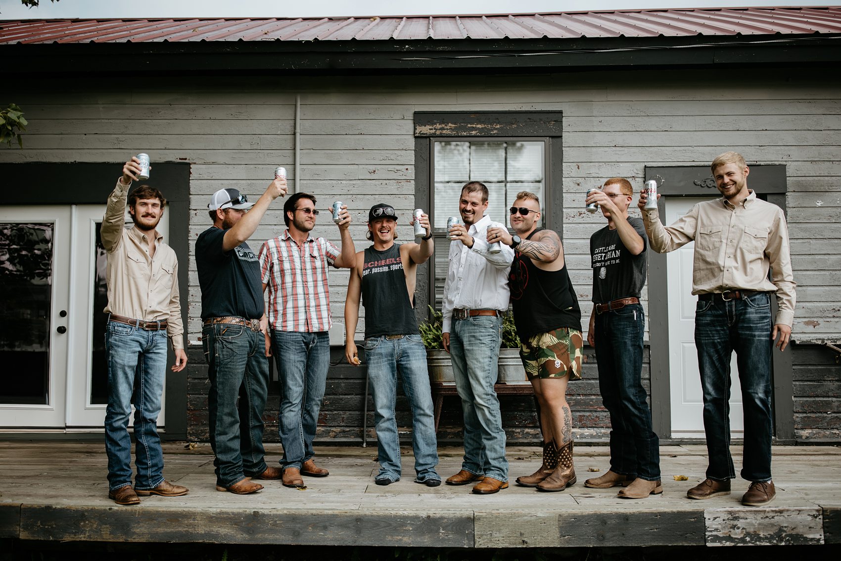 The groom and groomsmen get ready in the bridal suite at Prairie Meadows Venue