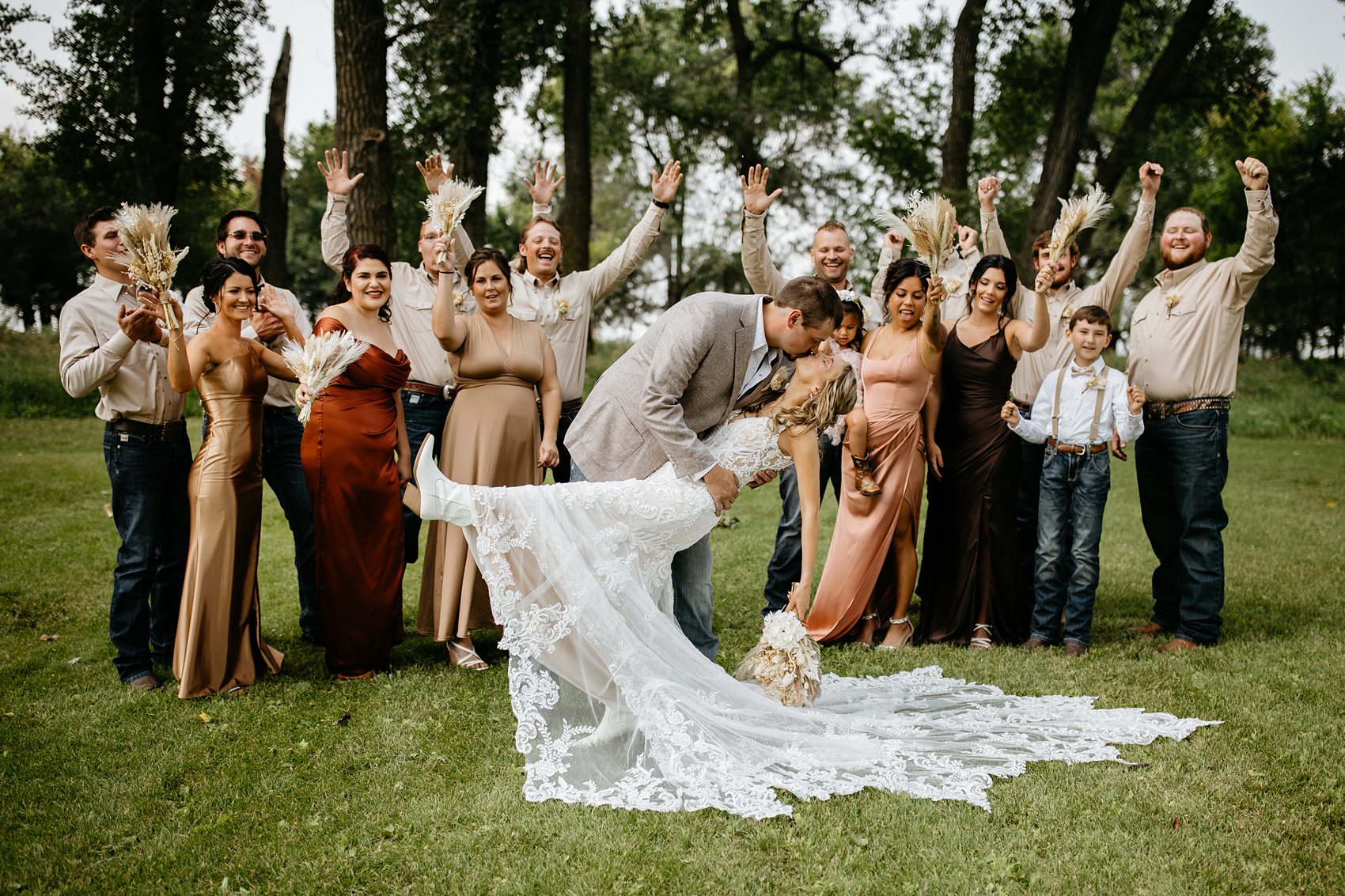 The wedding party was the perfect mix of boho and western for this Prairie Meadows Venue wedding.