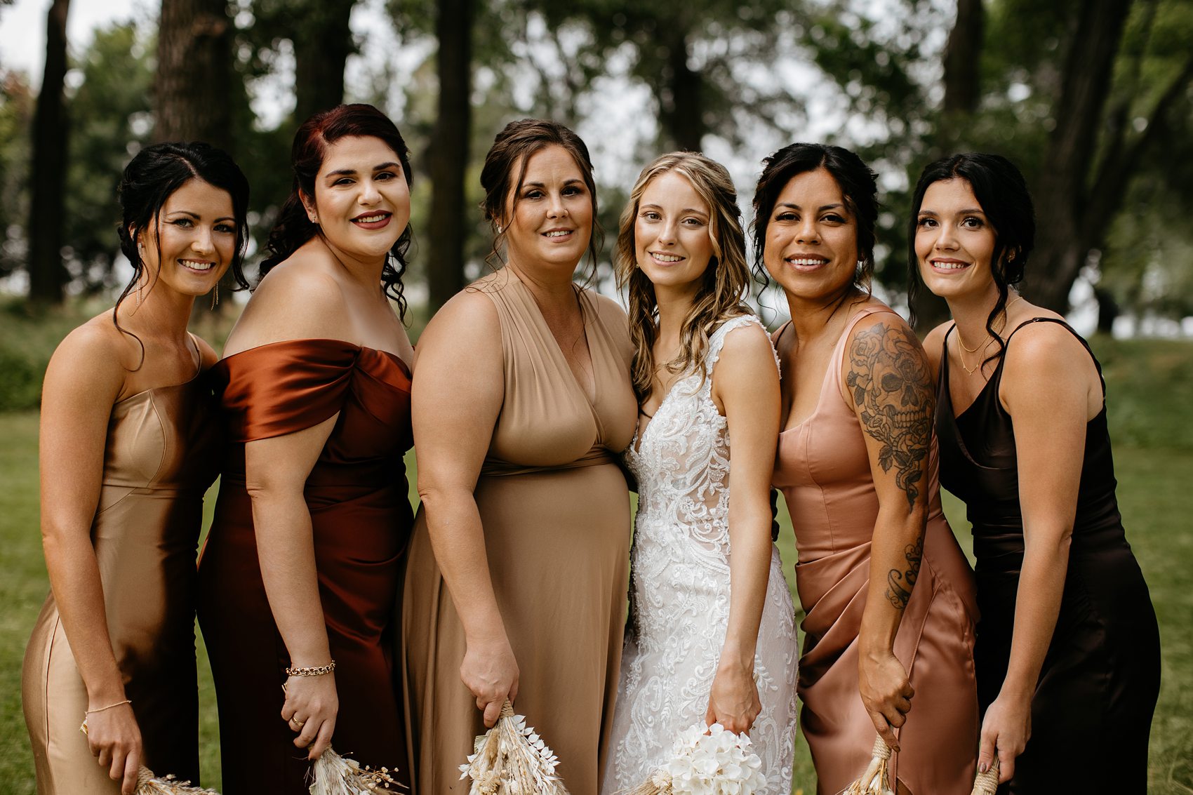 The wedding party was the perfect mix of boho and western for this Prairie Meadows Venue wedding.