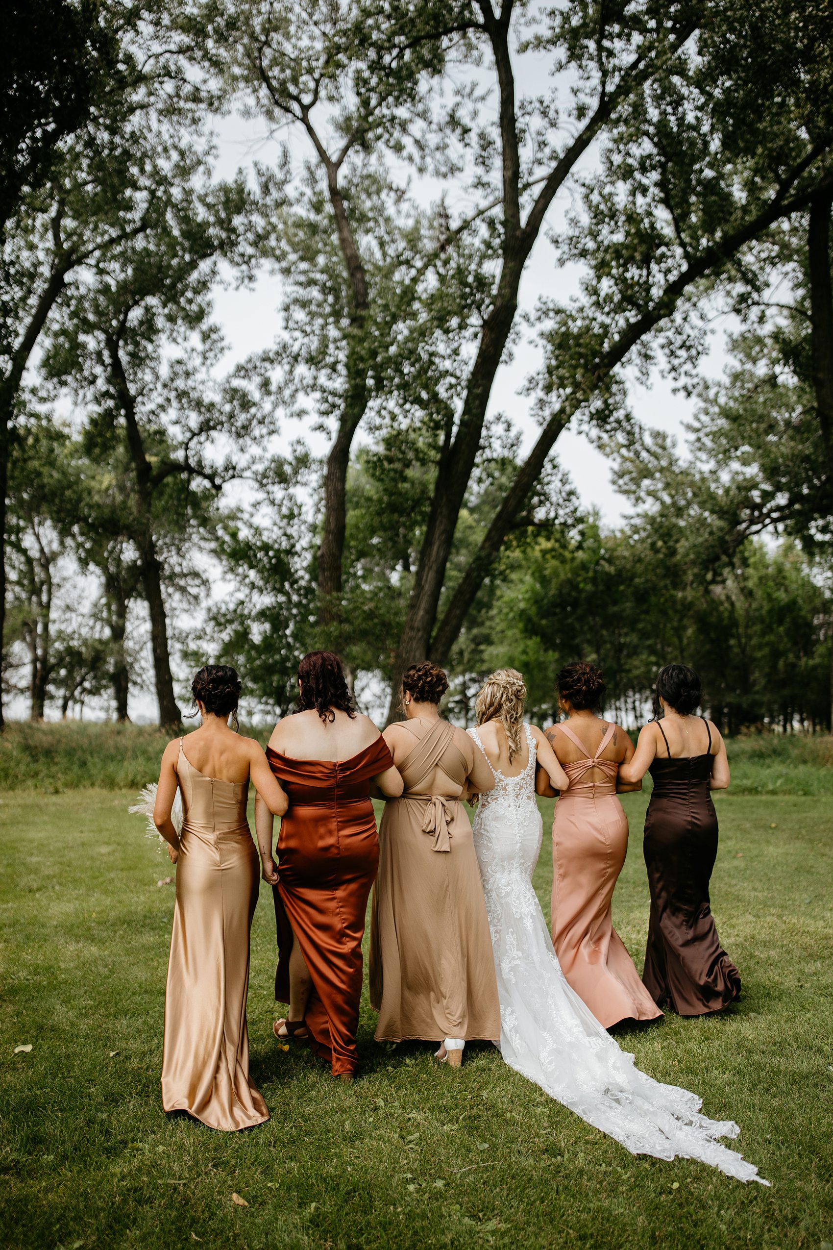 The wedding party was the perfect mix of boho and western for this Prairie Meadows Venue wedding.