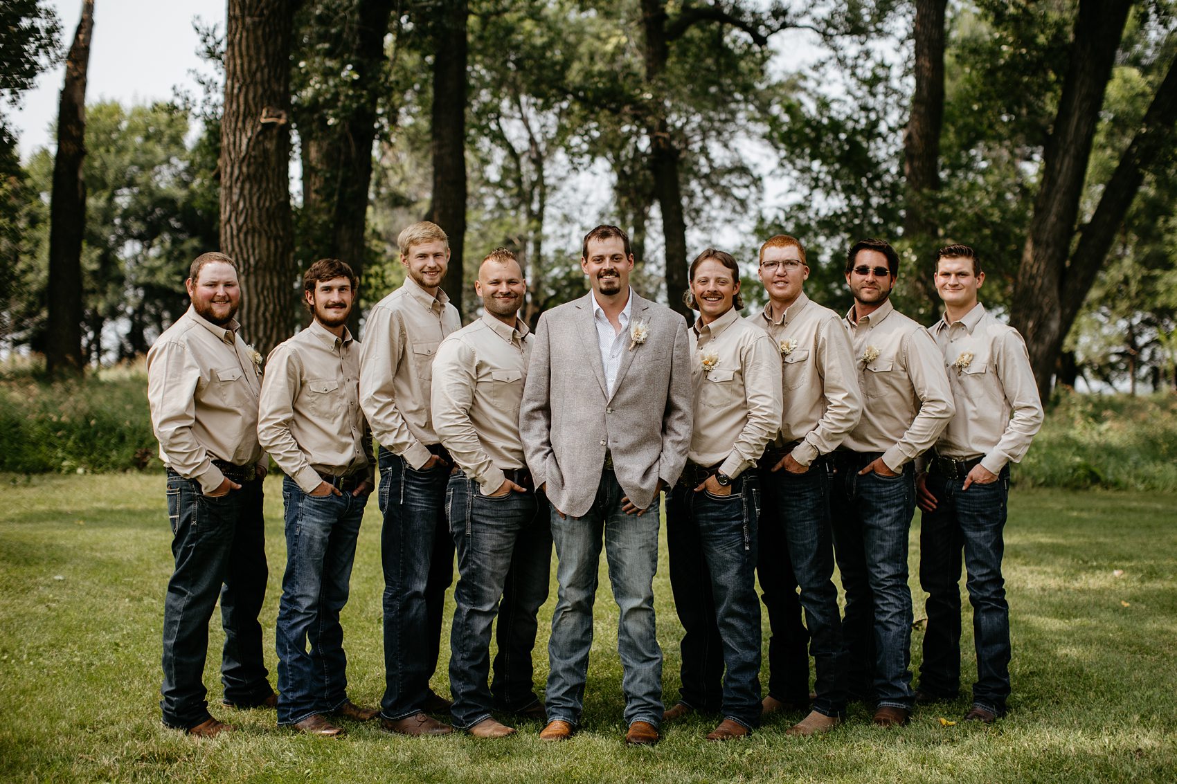 The wedding party was the perfect mix of boho and western for this Prairie Meadows Venue wedding.